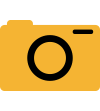 A yellow camera icon with a circular lens in the center and a small dot in the upper right corner, representing a flash. The icon is simple and minimalist in design.